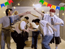 a group of people are dancing in a room with a sign that says atelier on it