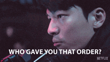 a close up of a man with the words who gave you that order