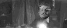 a black and white photo of a man 's head flying through the air