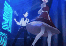 a man and a woman are dancing in front of a zebra print wall