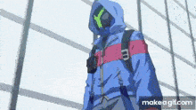 a man wearing a blue jacket and a mask is standing in front of a building .