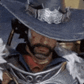 a man with a beard and a hat is holding a sword .