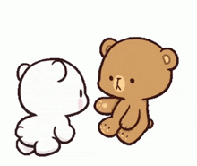 a couple of teddy bears are sitting next to each other and kissing .