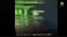 a blurred image of a green and black background with a few lines on it .