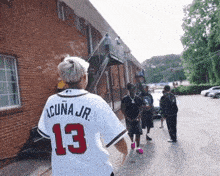 a person wearing a jersey with the number 13