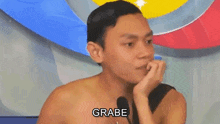 a shirtless man is sitting in front of a microphone with the words matinding digital footprint yun written below him