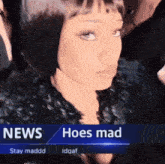 a woman is standing in front of a news screen that says hoes mad