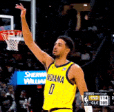 a basketball player wearing a yellow indiana jersey number 0