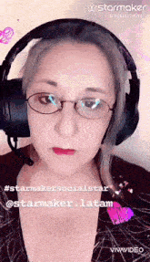 a woman wearing glasses and headphones has a starmaker id in the corner