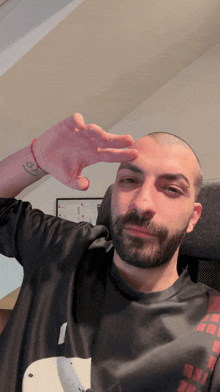 a man with a tattoo on his wrist that says ' i love you ' on it