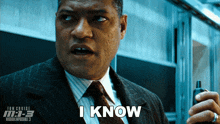 a man is holding a walkie talkie and says i know