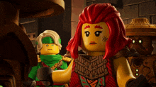 a lego character with red hair has a tattoo on her chest