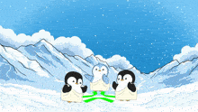 three penguins are standing in the snow in front of a mountain