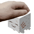 a person 's hand is holding a small white cube .