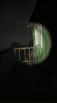a blurry picture of a building with a window