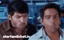 two men are looking at each other with the website starttamilchat.in visible in the corner