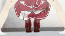 a girl in a red skirt and brown boots is standing