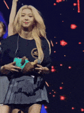 a woman wearing a black shirt with a crown on it
