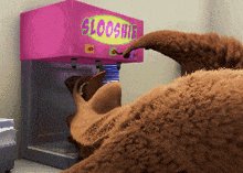a cartoon bear is getting a slushie from a pink machine