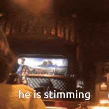 a person is playing a video game and the words he is stunning are visible