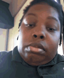 a close up of a person making a funny face with their mouth open