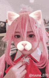a girl with pink hair is wearing a cat costume and has the number 070 on her face