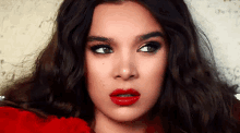 a close up of a woman wearing red lipstick