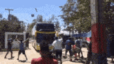 a group of people are standing in front of a double decker bus that says ' jeep ' on it