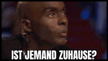 a bald man with a microphone in his ear says ist jemand zuhause ?