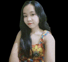 a woman with long black hair is wearing a colorful dress