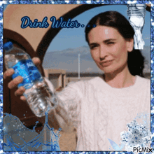 a picture of a woman holding a bottle of water with the words drink water below her