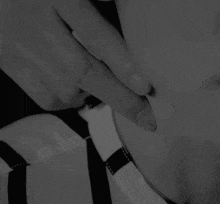 a black and white photo of a person 's neck