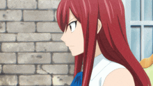 a girl with long red hair is wearing a white shirt and a blue bow