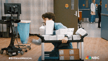 a nbc ad for st denis medical shows a person pushing a cart