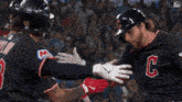 a baseball player wearing a uniform with the letter c on it