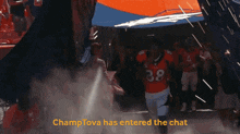 a football player with the number 38 on his jersey is running through a tunnel