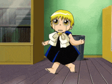 a little girl in a black and blue dress is standing on a wooden floor