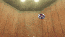a spinning top is spinning in the air in a room .