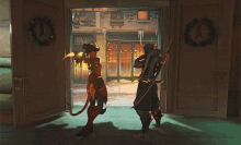 a man and a woman are standing in front of a door that has a wreath on it that says christmas