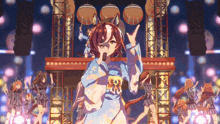a group of anime girls are dancing on a stage with one girl wearing a blue kimono