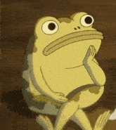 a cartoon frog is sitting down and looking at something