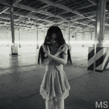 a black and white photo of a woman with the letters ms on the bottom left