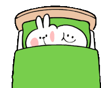 a cartoon character is laying in a bed with a green blanket