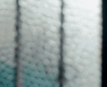a blurred image of a mattress with a blue and white pattern