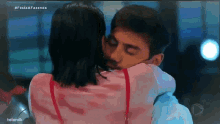 a man and a woman hugging with the hashtag festaa fazenda at the top