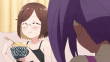 a girl with glasses is eating a bowl of food