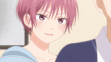 a girl with pink hair and earrings is looking at a man