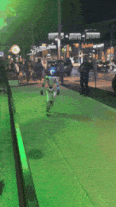 a person in a robot costume is walking down a street