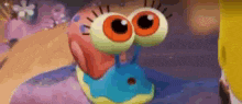 a cartoon snail with big eyes is crawling on a purple surface .