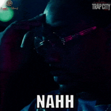a man smoking a cigarette with the word nahh on his face